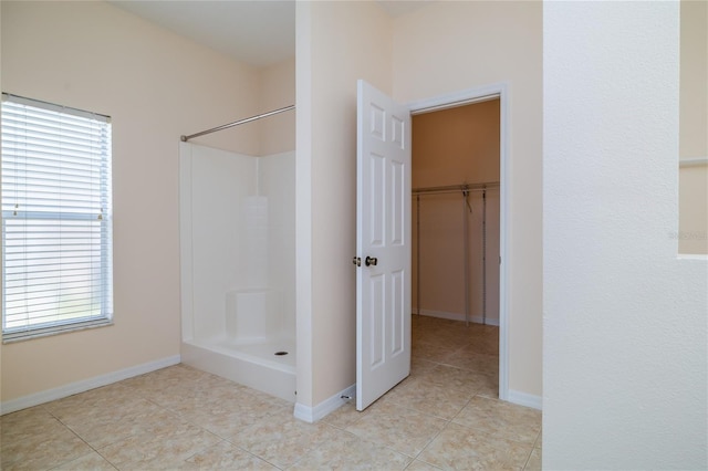 404 Central Mariners Dr, Edgewater, FL 32141 - full bathroom featuring a shower, tile patterned floors, and baseboards