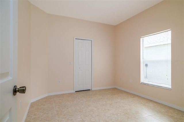 404 Central Mariners Dr, Edgewater, FL 32141 - empty room with light tile patterned floors and baseboards