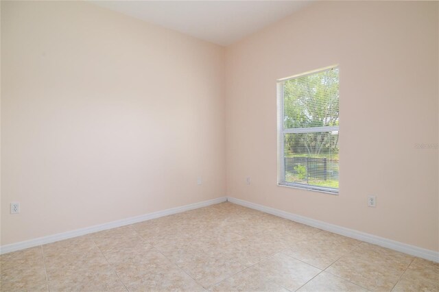 404 Central Mariners Dr, Edgewater, FL 32141 - unfurnished room with healthy amount of natural light, light tile patterned floors, and baseboards