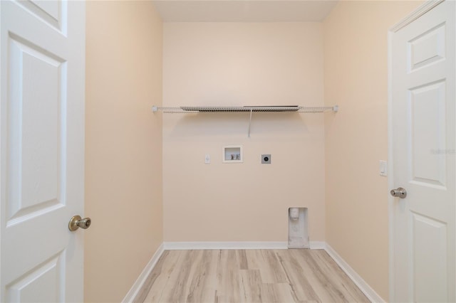 404 Central Mariners Dr, Edgewater, FL 32141 - laundry room with electric dryer hookup, hookup for a washing machine, light wood finished floors, and baseboards