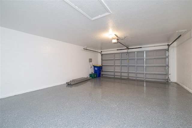 404 Central Mariners Dr, Edgewater, FL 32141 - garage featuring a garage door opener and baseboards