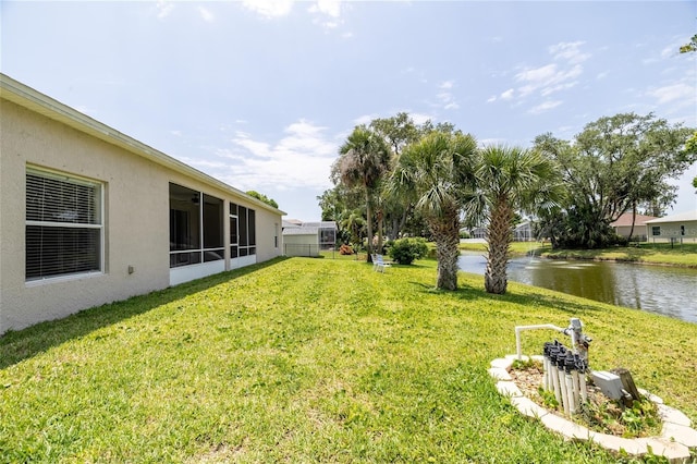 404 Central Mariners Dr, Edgewater, FL 32141 - view of green lawn featuring a water view and a sunroom