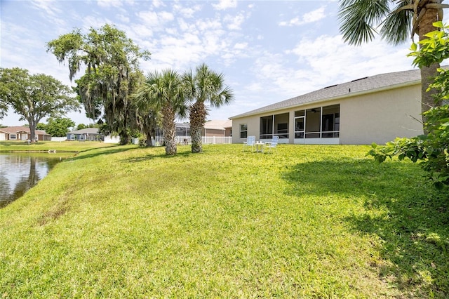 404 Central Mariners Dr, Edgewater, FL 32141 - view of grassy yard with a water view and a sunroom