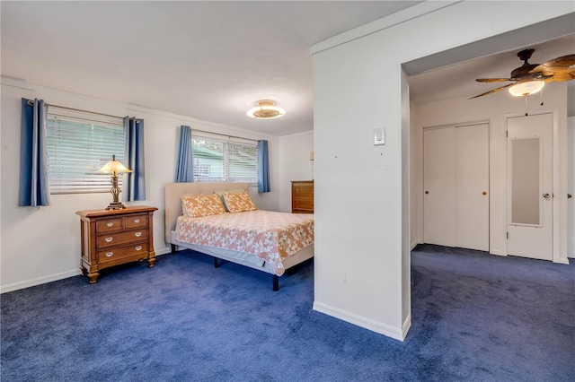 carpeted bedroom with baseboards, ceiling fan, and a closet