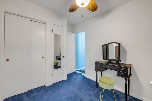 home office featuring carpet flooring, ceiling fan, and baseboards