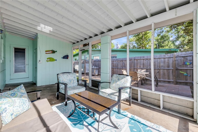 sunroom / solarium featuring an outdoor hangout area
