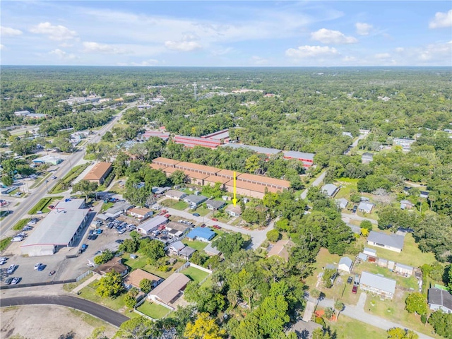 aerial view of property's location with a forest