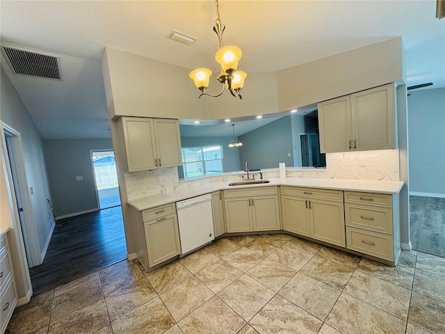 3303 Victory Palm Dr, Edgewater, FL 32141 - kitchen with dishwasher, a chandelier, a sink, and tasteful backsplash