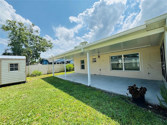 3303 Victory Palm Dr, Edgewater, FL 32141 - back of house featuring a patio area, a shed, and an outdoor structure
