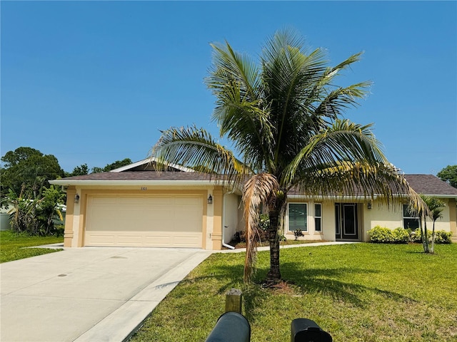 3303 Victory Palm Dr, Edgewater, FL 32141 - single story home with a garage, concrete driveway, a front yard, and stucco siding
