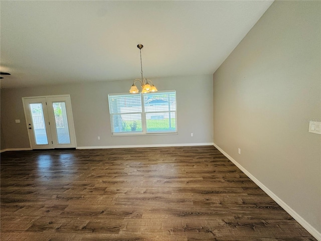3303 Victory Palm Dr, Edgewater, FL 32141 - unfurnished dining area featuring healthy amount of natural light, dark wood-type flooring, a chandelier, and baseboards