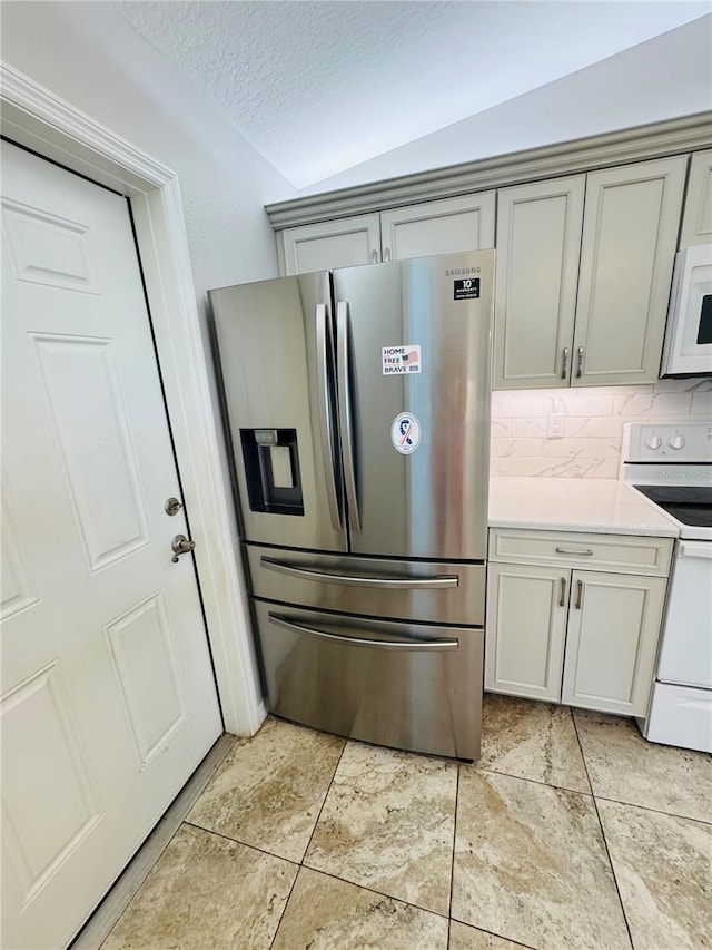 3303 Victory Palm Dr, Edgewater, FL 32141 - kitchen with white appliances, gray cabinets, light countertops, tasteful backsplash, and a textured ceiling
