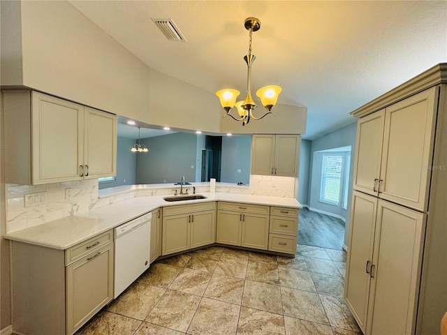 3303 Victory Palm Dr, Edgewater, FL 32141 - kitchen featuring white dishwasher, a sink, a chandelier, vaulted ceiling, and decorative backsplash