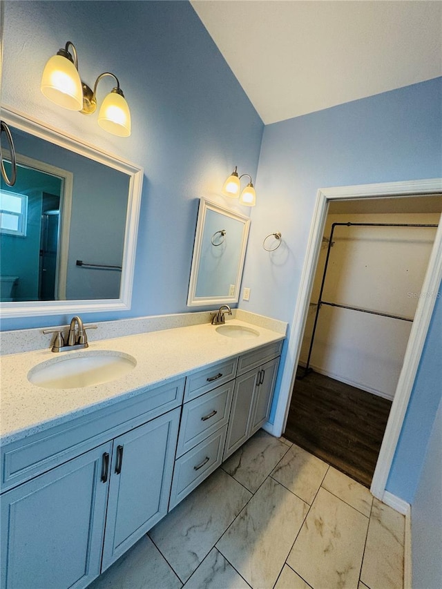 3303 Victory Palm Dr, Edgewater, FL 32141 - full bathroom featuring marble finish floors, double vanity, a spacious closet, and a shower with shower door