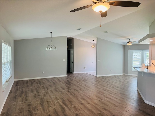3303 Victory Palm Dr, Edgewater, FL 32141 - unfurnished living room with a ceiling fan, vaulted ceiling, dark wood finished floors, and baseboards