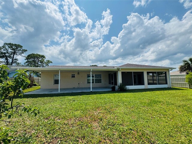 3303 Victory Palm Dr, Edgewater, FL 32141 - back of property with a patio area, stucco siding, and a sunroom