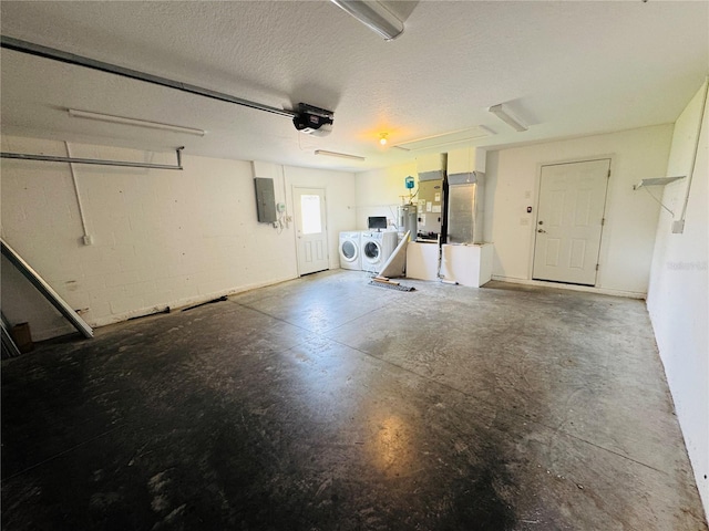 3303 Victory Palm Dr, Edgewater, FL 32141 - garage featuring washer and clothes dryer, a garage door opener, and electric panel