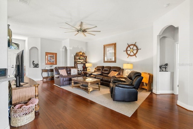 637 Marisol Dr, New Smyrna Beach, FL 32168 - living room with arched walkways, ceiling fan, wood finished floors, and baseboards