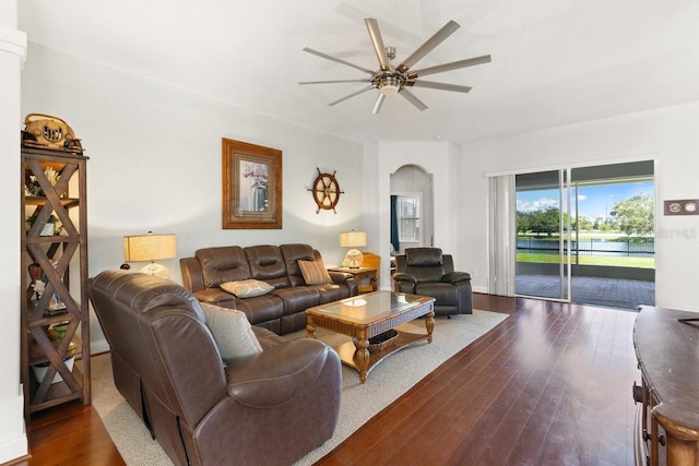 637 Marisol Dr, New Smyrna Beach, FL 32168 - living room featuring ceiling fan, dark wood-style floors, and arched walkways