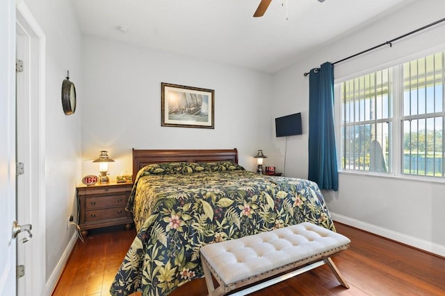 637 Marisol Dr, New Smyrna Beach, FL 32168 - bedroom featuring baseboards, wood finished floors, and a ceiling fan