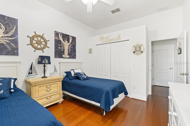 637 Marisol Dr, New Smyrna Beach, FL 32168 - bedroom with dark wood-style flooring, a closet, baseboards, and a ceiling fan