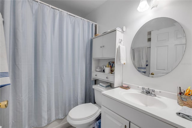 bathroom featuring toilet, vanity, and shower / tub combo with curtain