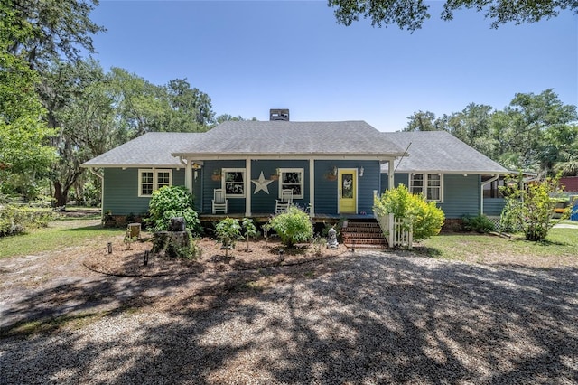 4580 Lake James Cir, Edgewater, FL 32141 - view of front of home with a porch and a chimney