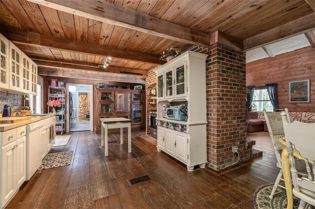 4580 Lake James Cir, Edgewater, FL 32141 - kitchen featuring beamed ceiling, dark wood-type flooring, wooden ceiling, dishwasher, and glass insert cabinets