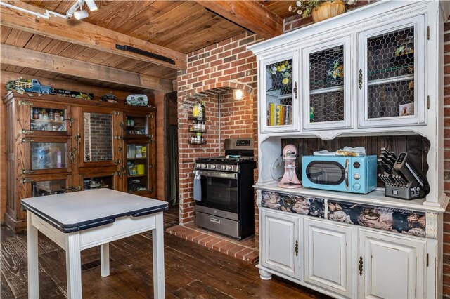 4580 Lake James Cir, Edgewater, FL 32141 - kitchen with stainless steel gas range, wood ceiling, dark wood-style floors, beamed ceiling, and white cabinets