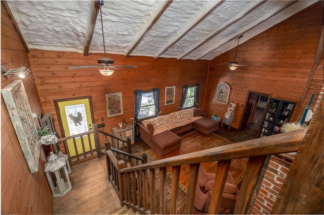 4580 Lake James Cir, Edgewater, FL 32141 - living area with a ceiling fan, wood finished floors, wooden walls, and lofted ceiling