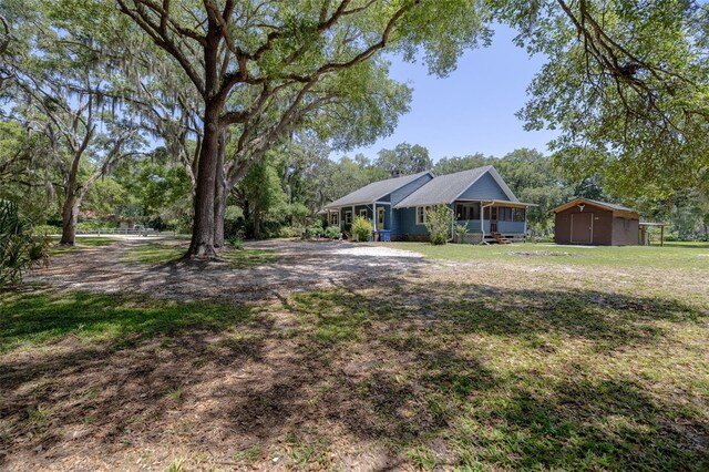 4580 Lake James Cir, Edgewater, FL 32141 - view of grassy yard featuring view of scattered trees