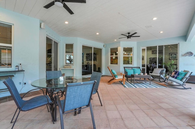 view of patio featuring a ceiling fan, an outdoor living space, and outdoor dining area