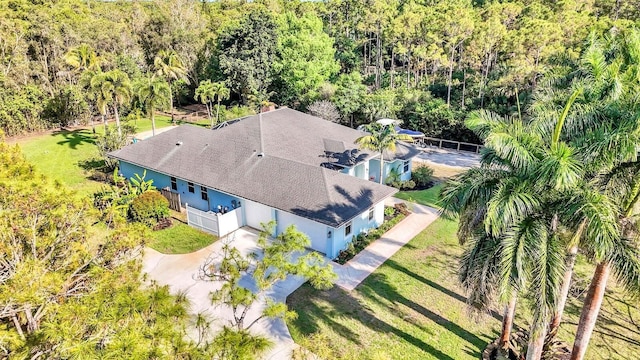 view from above of property with a forest