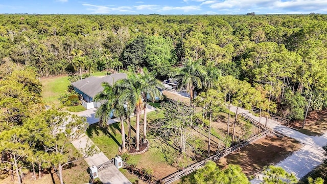 view of subject property with a forest