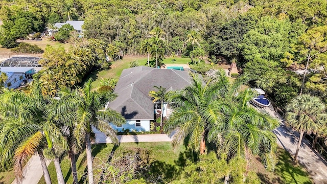 view from above of property with a forest