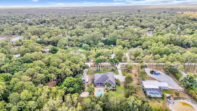 drone / aerial view of a heavily wooded area