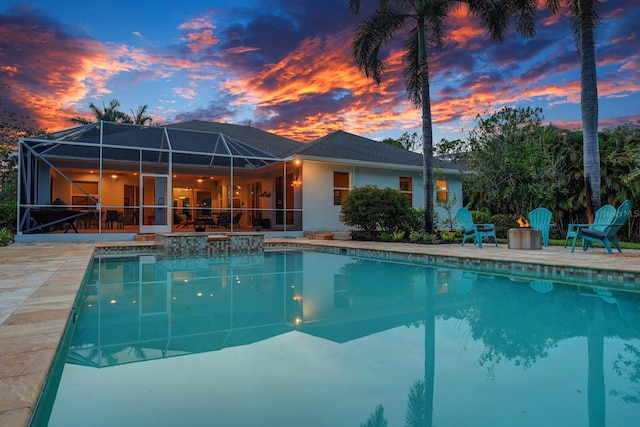 outdoor pool featuring a patio and a lanai
