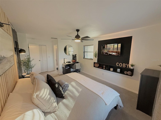 208 Wellington Dr, Daytona Beach, FL 32119 - bedroom with carpet flooring, a ceiling fan, and baseboards