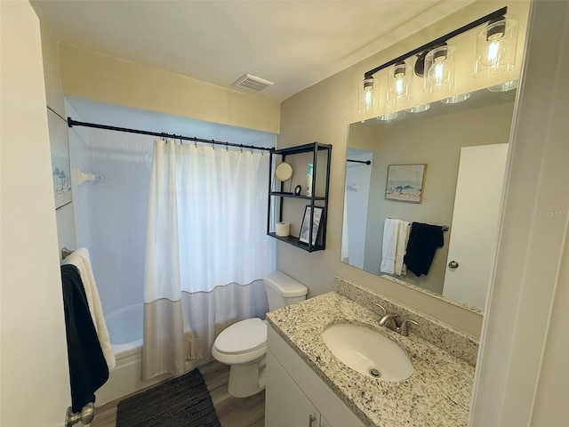 208 Wellington Dr, Daytona Beach, FL 32119 - bathroom with toilet, shower / tub combo with curtain, wood finished floors, and vanity