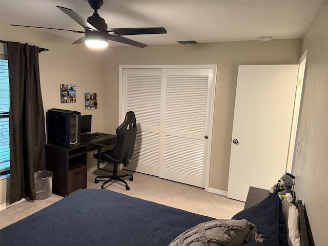208 Wellington Dr, Daytona Beach, FL 32119 - bedroom with light colored carpet, a closet, and baseboards