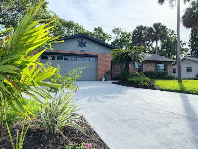 208 Wellington Dr, Daytona Beach, FL 32119 - ranch-style house featuring brick siding, concrete driveway, and a garage