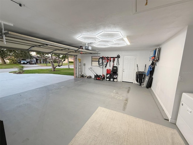 208 Wellington Dr, Daytona Beach, FL 32119 - garage featuring a garage door opener and baseboards