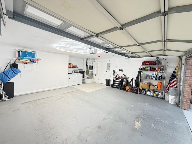 208 Wellington Dr, Daytona Beach, FL 32119 - garage with washing machine and clothes dryer, a garage door opener, and electric panel