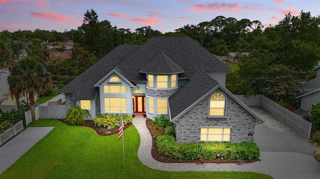 128 Godfrey Rd, Edgewater, FL 32141 - traditional home with a shingled roof