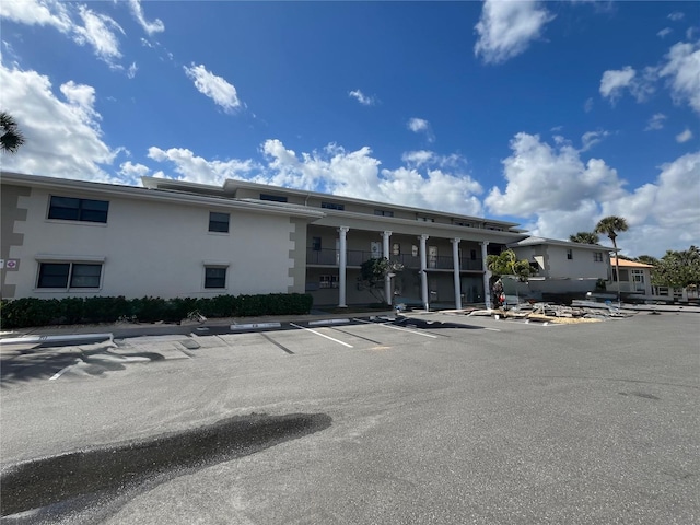 2100 N Peninsula Ave Unit 2160, New Smyrna Beach, FL 32169 - view of building exterior featuring uncovered parking