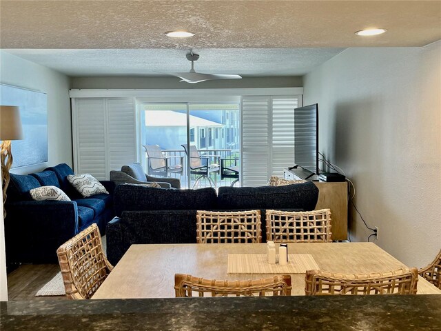2100 N Peninsula Ave Unit 2160, New Smyrna Beach, FL 32169 - dining space with healthy amount of natural light, wood finished floors, and a textured ceiling
