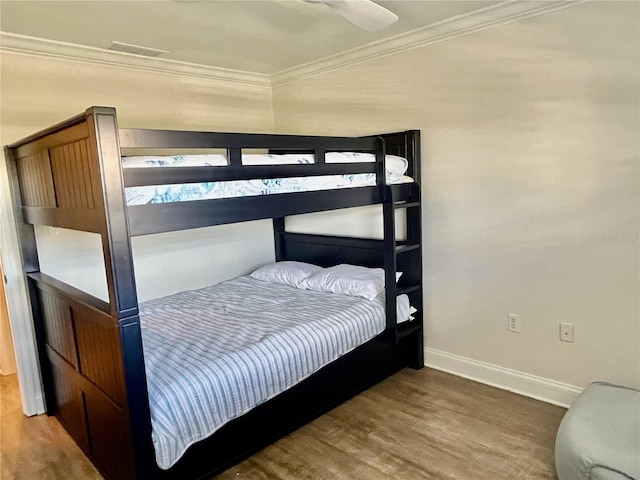 2100 N Peninsula Ave Unit 2160, New Smyrna Beach, FL 32169 - bedroom with wood finished floors, ornamental molding, baseboards, and a ceiling fan