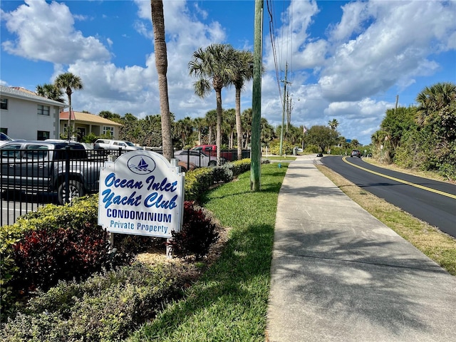 2100 N Peninsula Ave Unit 2160, New Smyrna Beach, FL 32169 - view of asphalt road featuring sidewalks