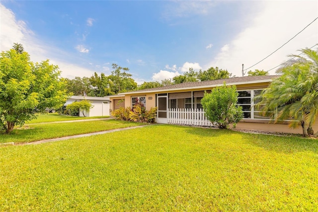 306 Jefferson Ave, Port Orange, FL 32127 - view of front of home featuring a sunroom and a front yard