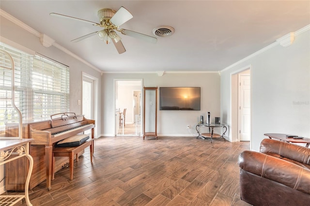 306 Jefferson Ave, Port Orange, FL 32127 - living area featuring crown molding, wood finished floors, ceiling fan, and baseboards